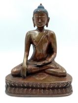 A Chinese Bronze Seated Buddha Figure. 20cm tall. 16cm width.