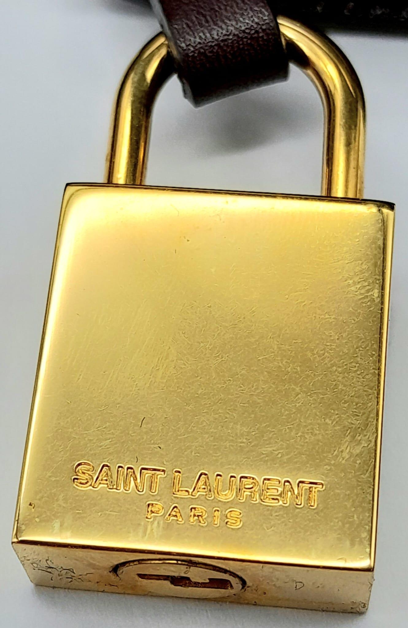 A Saint Laurent Sac De Jour Burgundy Handbag. Leather Exterior, Gold Tone Hardware, Double Handle in - Image 10 of 11
