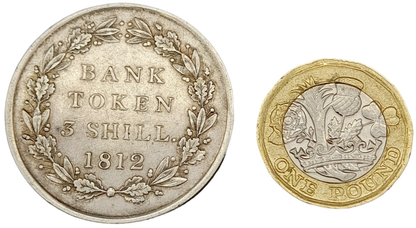 An 1812 George III Three Shilling Silver Token. Please see photos for conditions. Ref: 610001I - Image 2 of 3