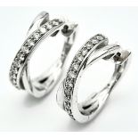 A PAIR OF 14K WHITE GOLD DIAMOND EARRINGS. 0.35ctw, 1.6cm diameter, 4.8g total weight. Ref: SC 8052