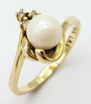 A Vintage 14K Yellow Gold Pearl and Diamond Crossover Ring. Size M. 2.65g total weight.