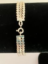 Italian 3 STRAND SILVER BRACELET.Having fancy closed scroll links. Condition As new and unworn.17