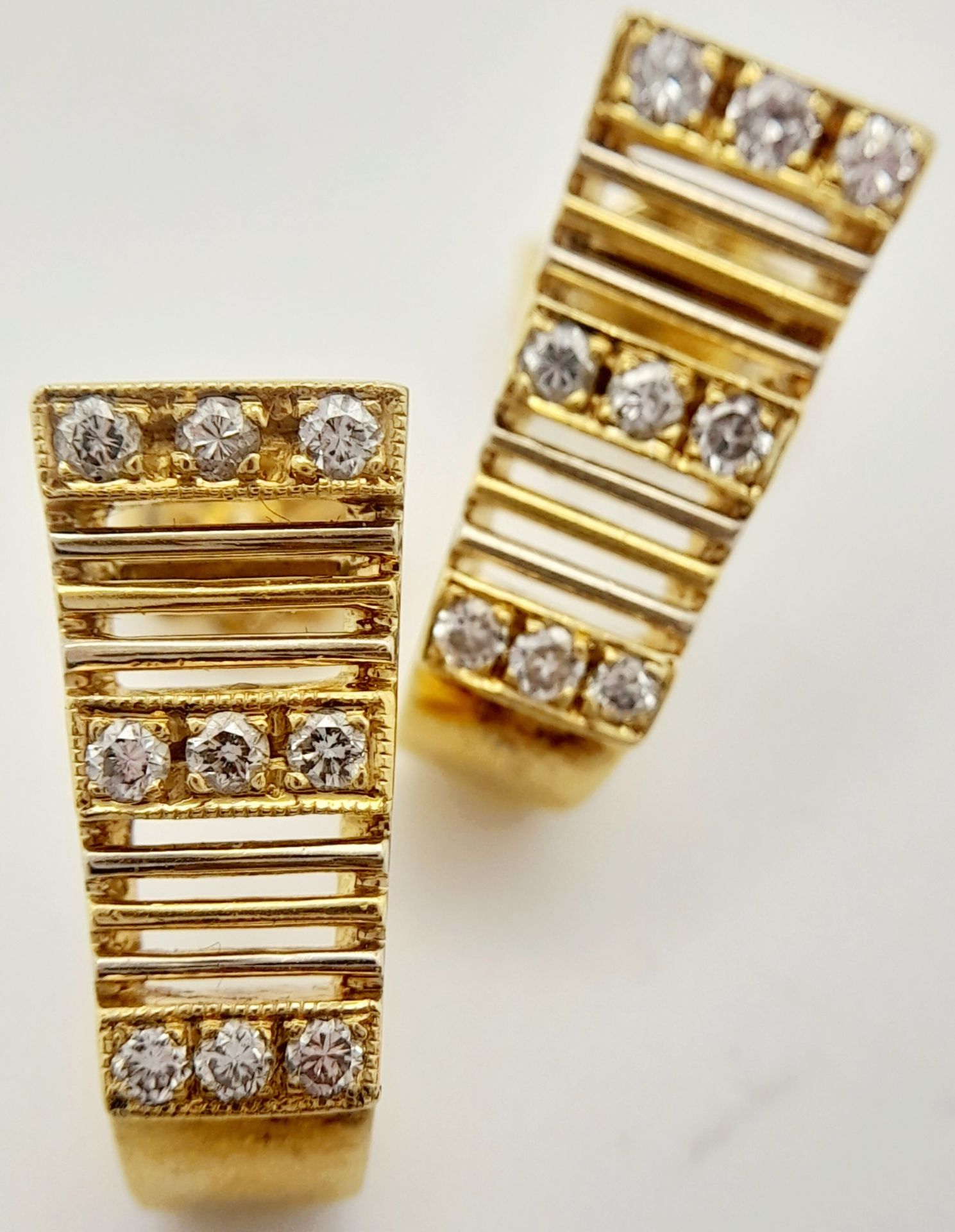 A PAIR OF 14K YELLOW GOLD DIAMOND SET EARRINGS. 0.20ctw, 1.7cm length, 4.7g total weight. Ref: SC