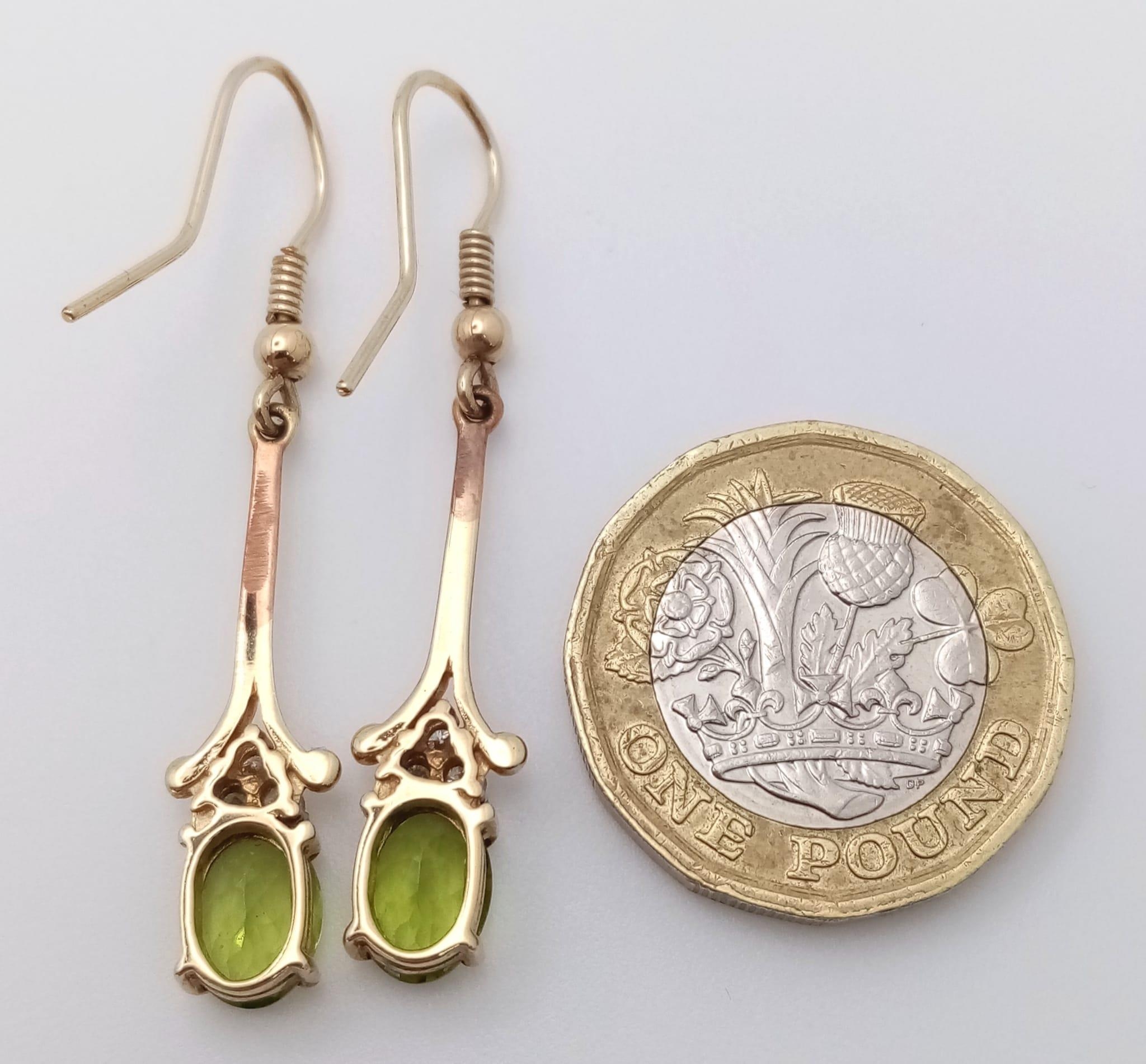 A 9K Yellow Gold, Peridot Drop Earring and Pendant Set. Both decorated with seed pearls. Pendant - - Image 6 of 7