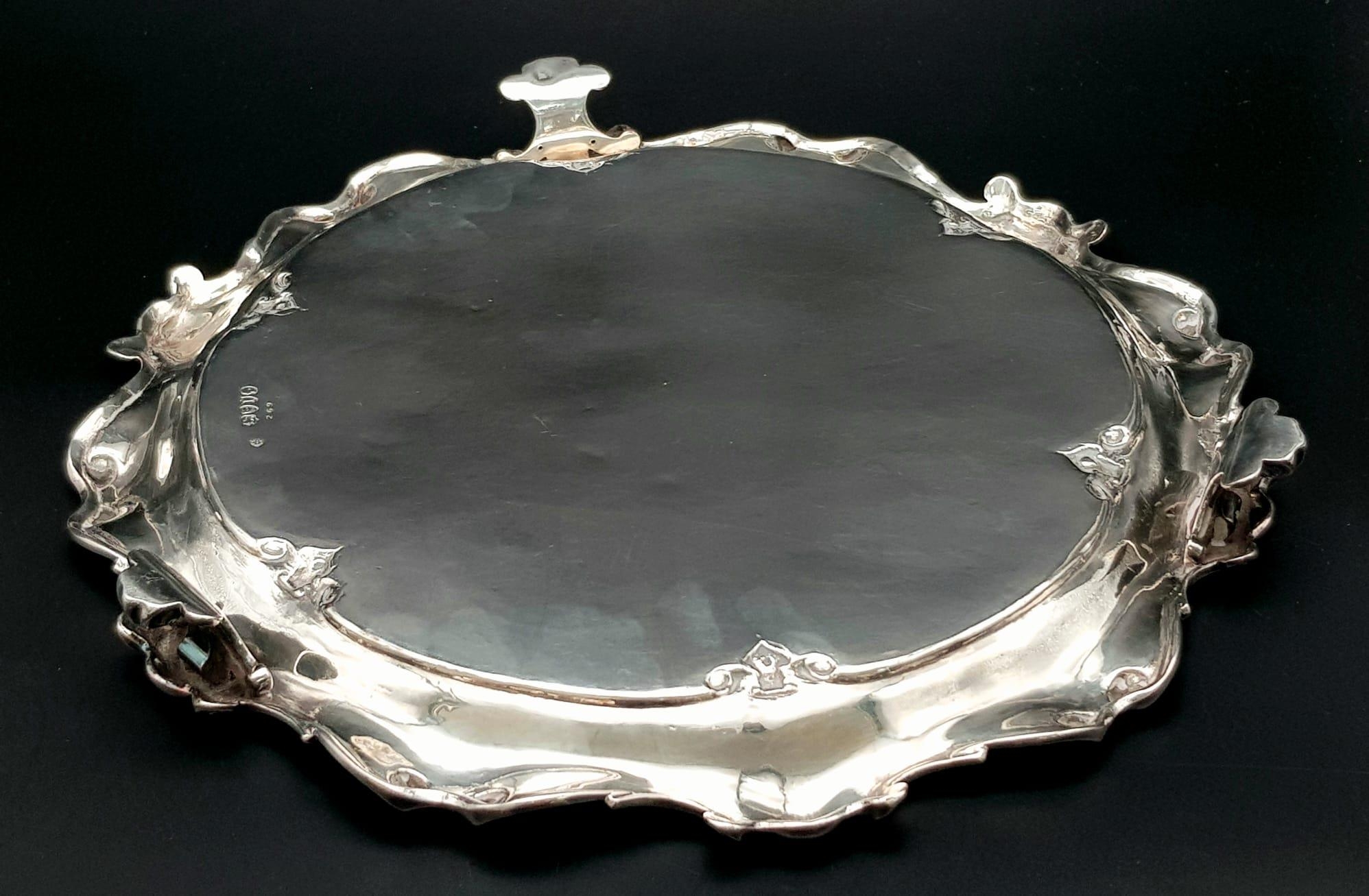 A 761gms solid silver Salva with scrolled edges and hand chased intricate decoration and - Image 2 of 6