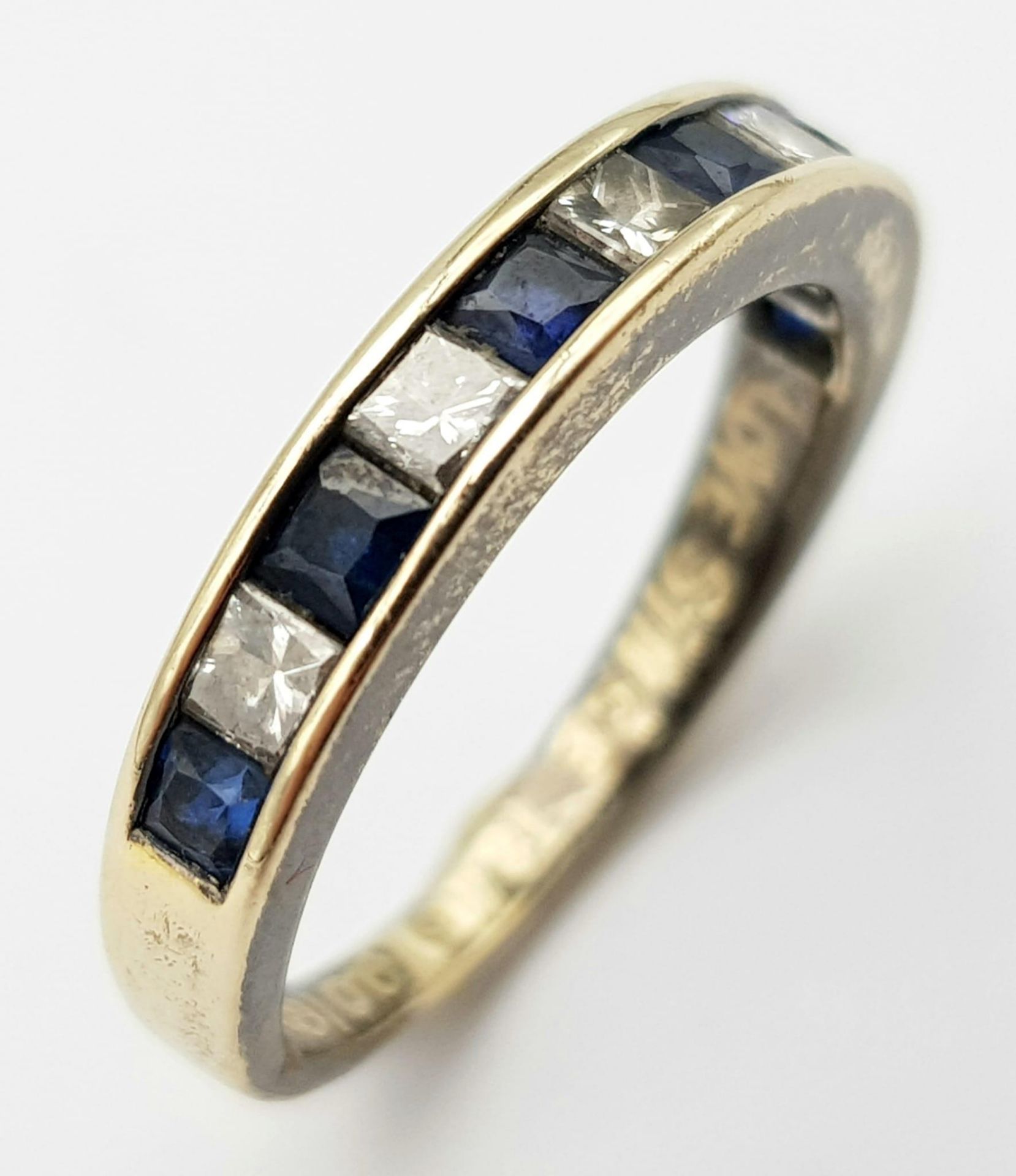 An 18K Gold Diamond and Sapphire Half-Eternity Ring. Size K. 3.1g total weight. Ref: 016637