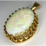 A Vintage 9K Yellow Gold Opal Pendant. 5ct opal cabochon (very small chip by mounting) - excellent