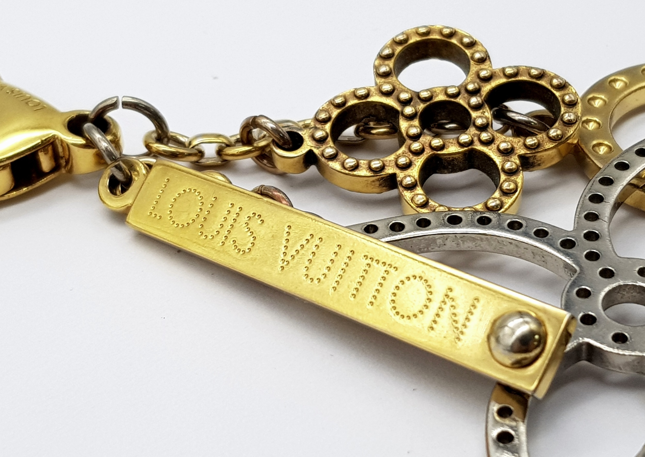 A Louis Vuitton Bijoux Sac Tapage Charm/Key Ring. Gold and silver-toned hardware with iconic LV - Image 6 of 7