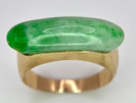 A 14K Yellow Gold Jade Ring. 1.8cm jade. Size K, 2.9g total weight.