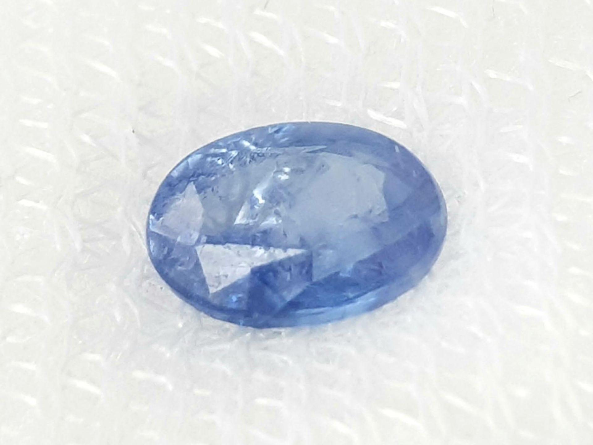 A 0.86ct Madagascan Blue Sapphire - AIG Certified in a sealed box. - Bild 2 aus 5