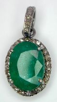 A 6ct Emerald and Diamond Pendant set in 925 Silver. Oval emerald with a diamond surround - 0.40ctw.
