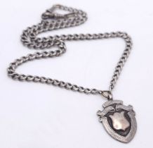 A SOLID SILVER "ALBERT" WATCH CHAIN WITH SHIELD FOB DATED 1930 . 28.6gms