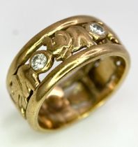 A 9K YELLOW GOLD (TESTS AS) DIAMOND SET ELEPHANT BAND RING. 0.20CT. 4.1G. SIZE J 1/2.