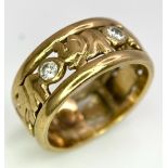 A 9K YELLOW GOLD (TESTS AS) DIAMOND SET ELEPHANT BAND RING. 0.20CT. 4.1G. SIZE J 1/2.