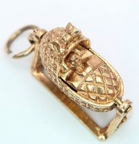 A 9K YELLOW GOLD BABY CRIB CHARM, WHICH MOVES. 2.6cm length, 3.7g total weight. Ref: SC 8010