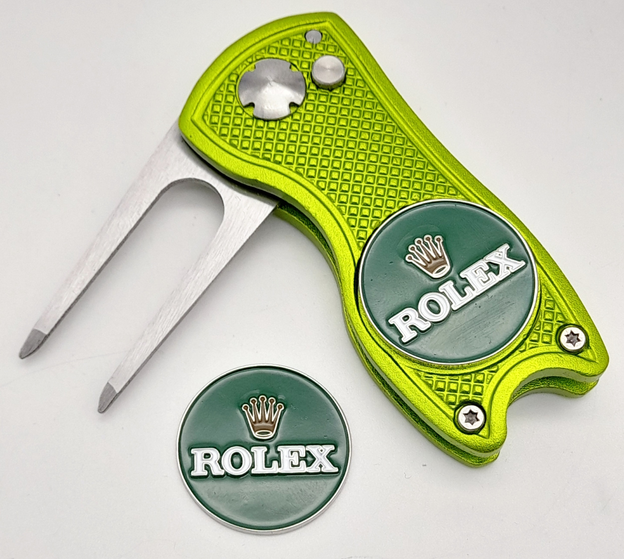 A Rolex Branded Retractable 'Flick' Golf Putting Divot Repair Tool. Removable magnetic ball marker -