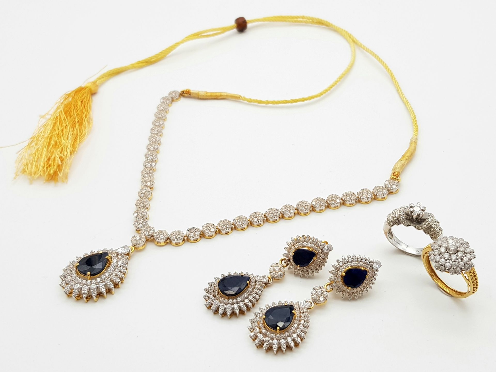 A Fabulous Jewellery Lot! A 21K Rich Yellow Gold Diamond and White Stone (one missing) Necklace with