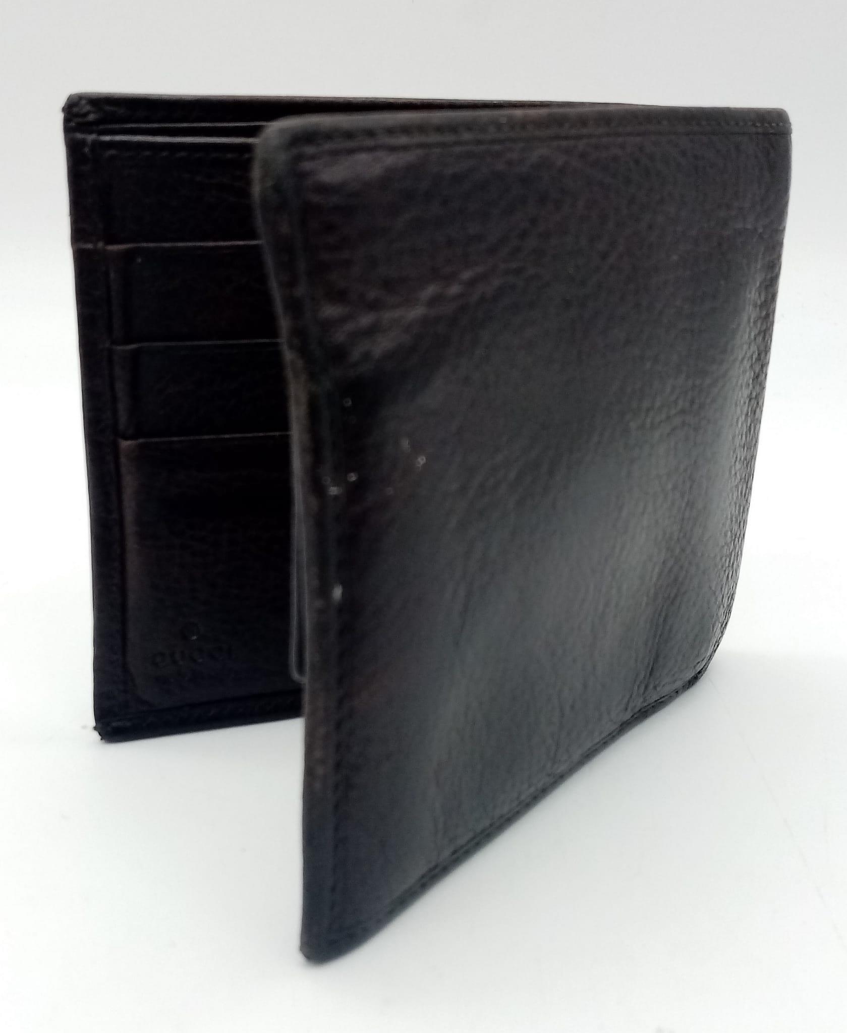 A dark brown leather Gucci card wallet, 3 card holders with a popper pocket. Size approx. - Bild 2 aus 6