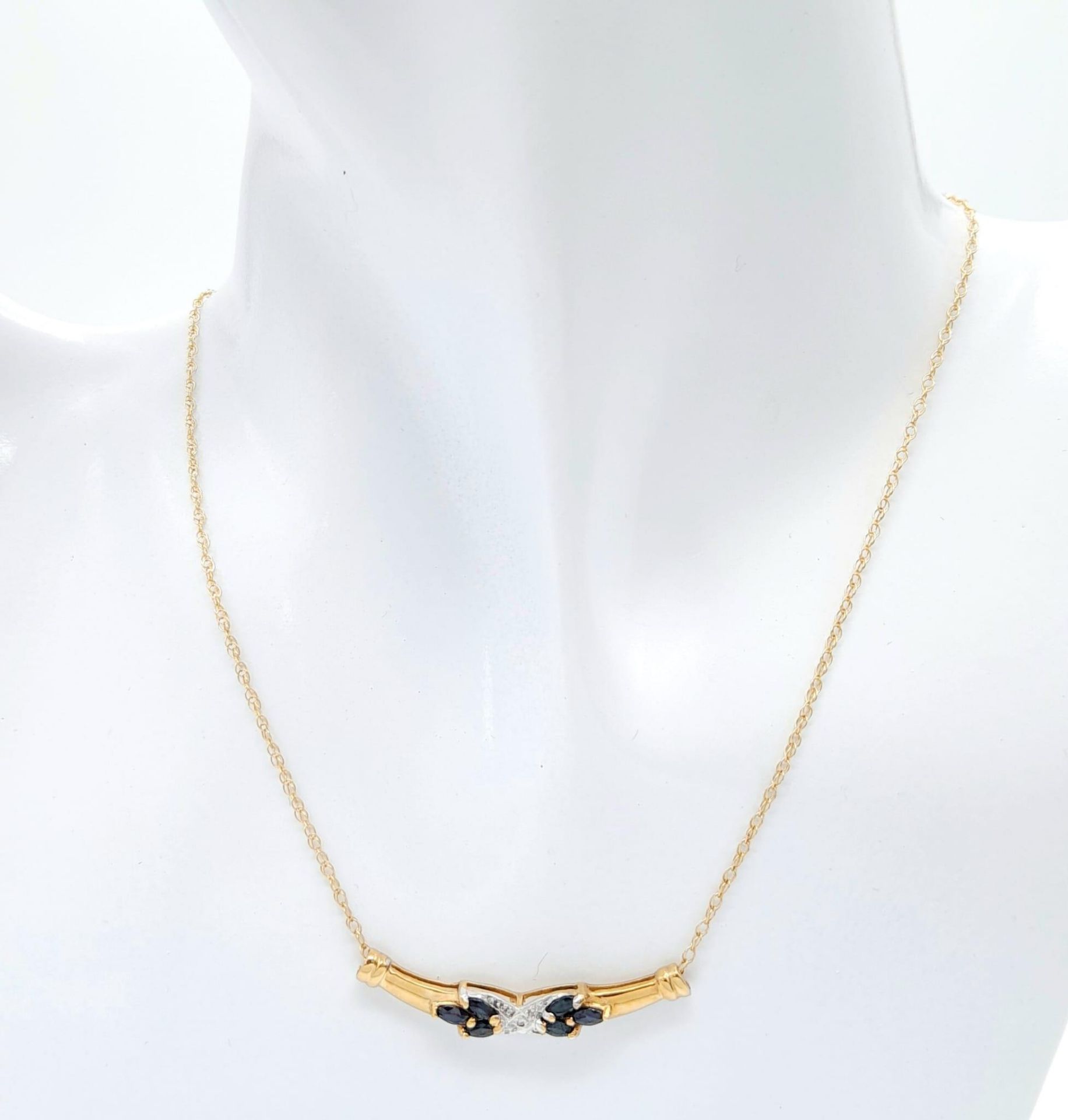A 9 Carat Yellow Gold Diamond and Sapphire Set Necklace. 45 cm Length. Set with a Centre Round Cut - Image 2 of 5