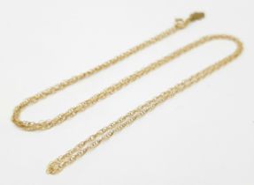 A 9K Yellow Gold Disappearing Necklace. 44cm. 0.75g