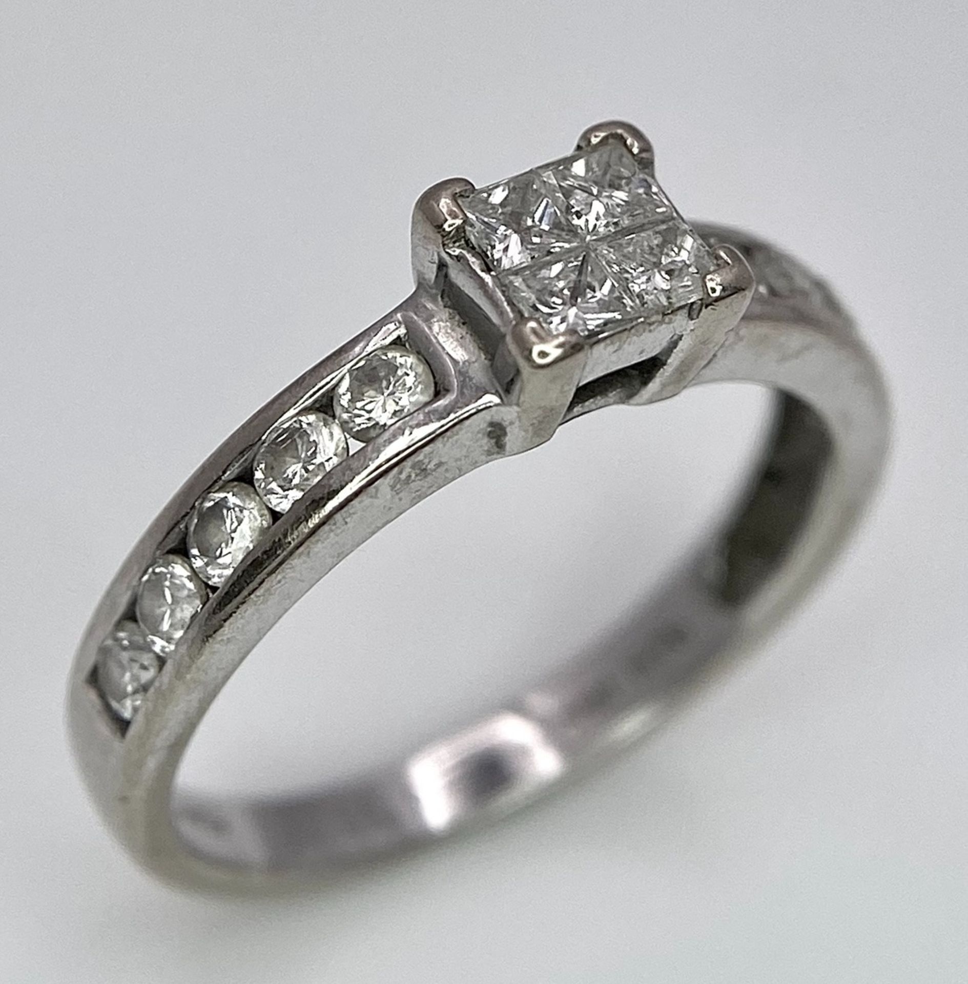 An 18K White Gold and Diamond Ring. Square and round cut diamonds. Size J. 2.6g total weight. - Image 5 of 7