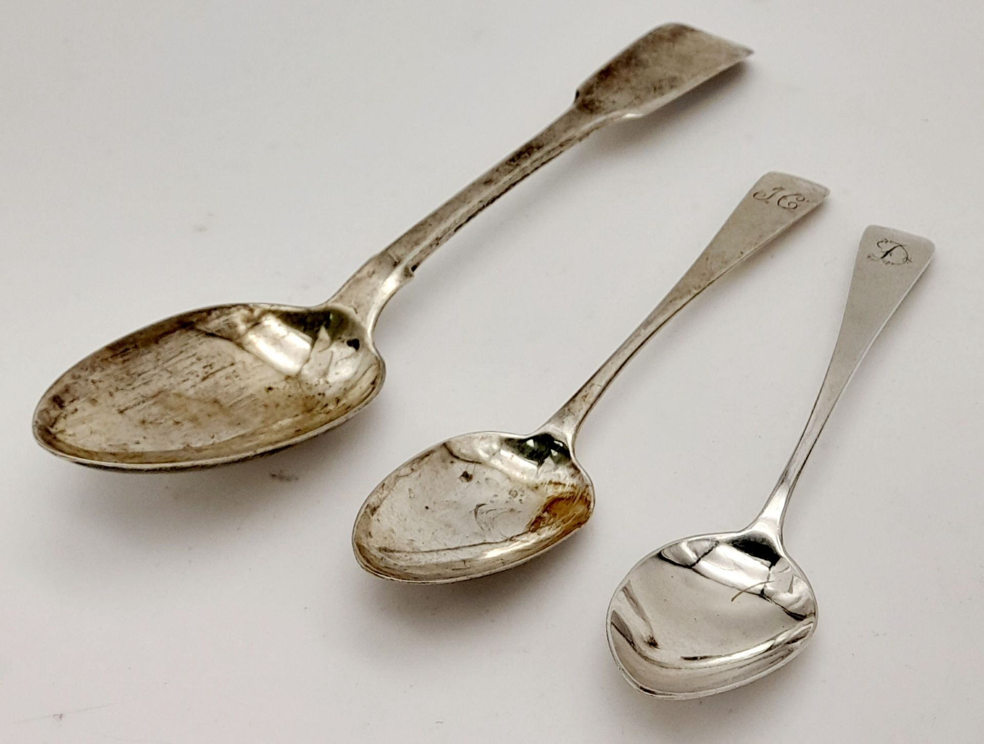 Three Pieces of Georgian Sterling Silver Flatware. Two small spoons and one serving spoon. Hallmarks