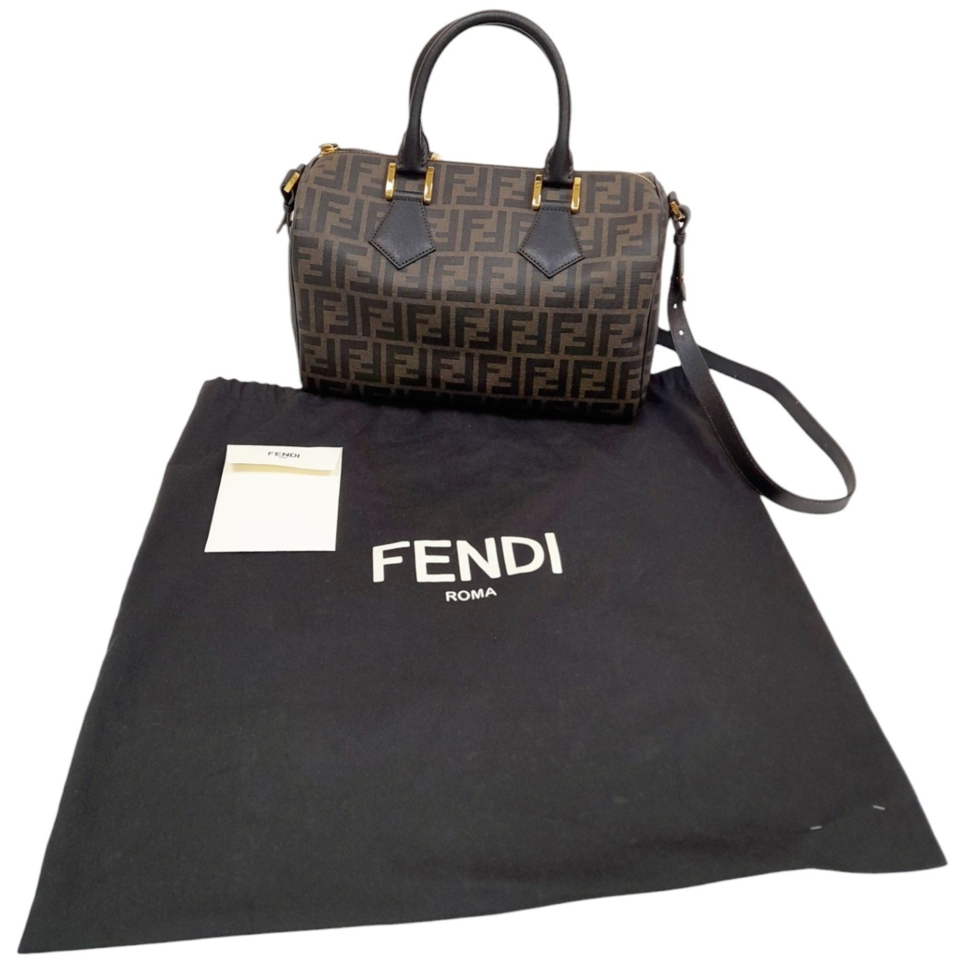 A Fendi Zucca Canvas Boston Bag. Canvas exterior, gold-tone hardware, adjustable strap, zipped top - Image 6 of 9