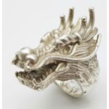 A STERLING SILVER DRAGONS HEAD RING, STUNNING DETAIL AND HEAVY. 4.2cm dragon head length, 86.8g