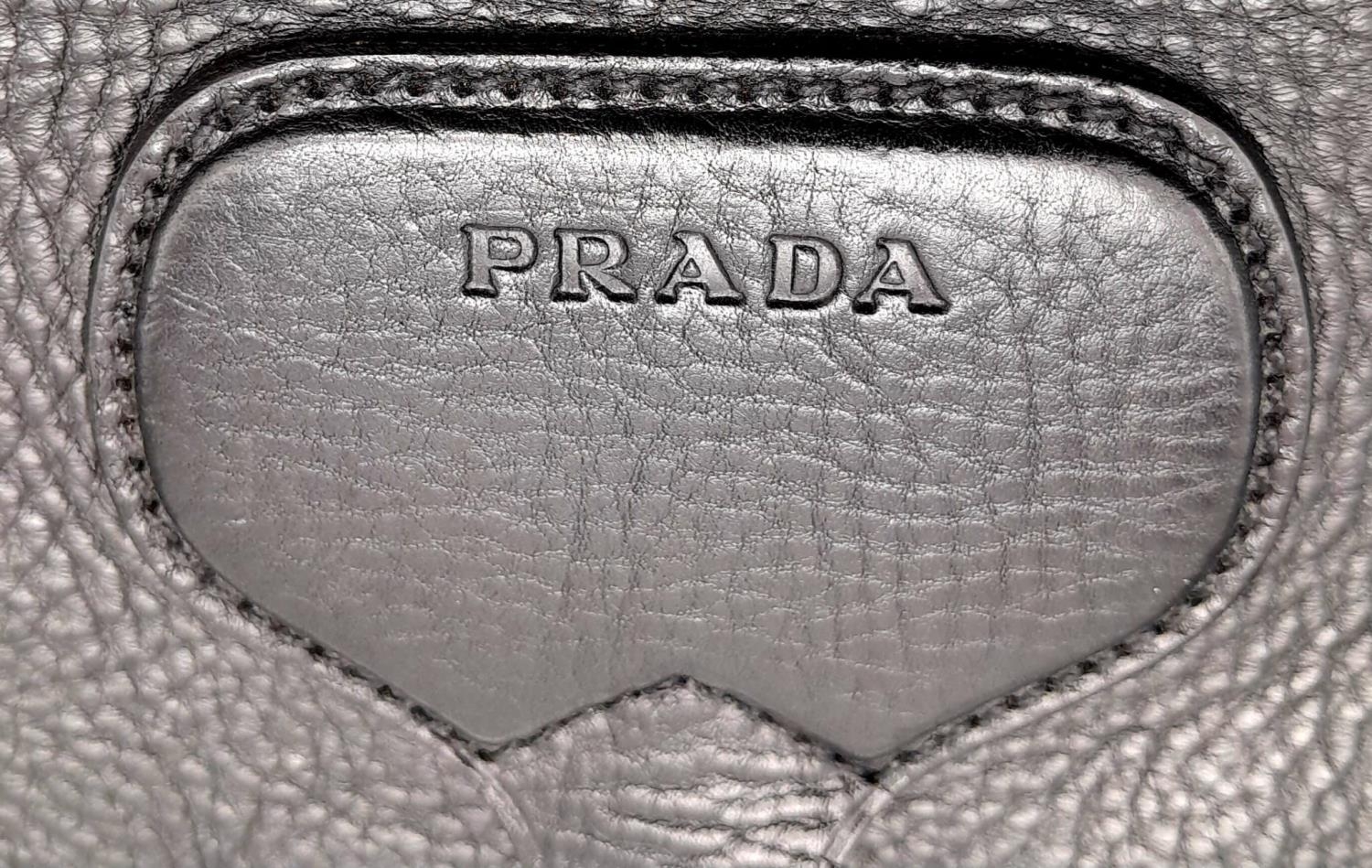 A Prada Black Leather Crossbody Satchel Bag. Textured exterior with buckled flap. Spacious leather - Image 14 of 14