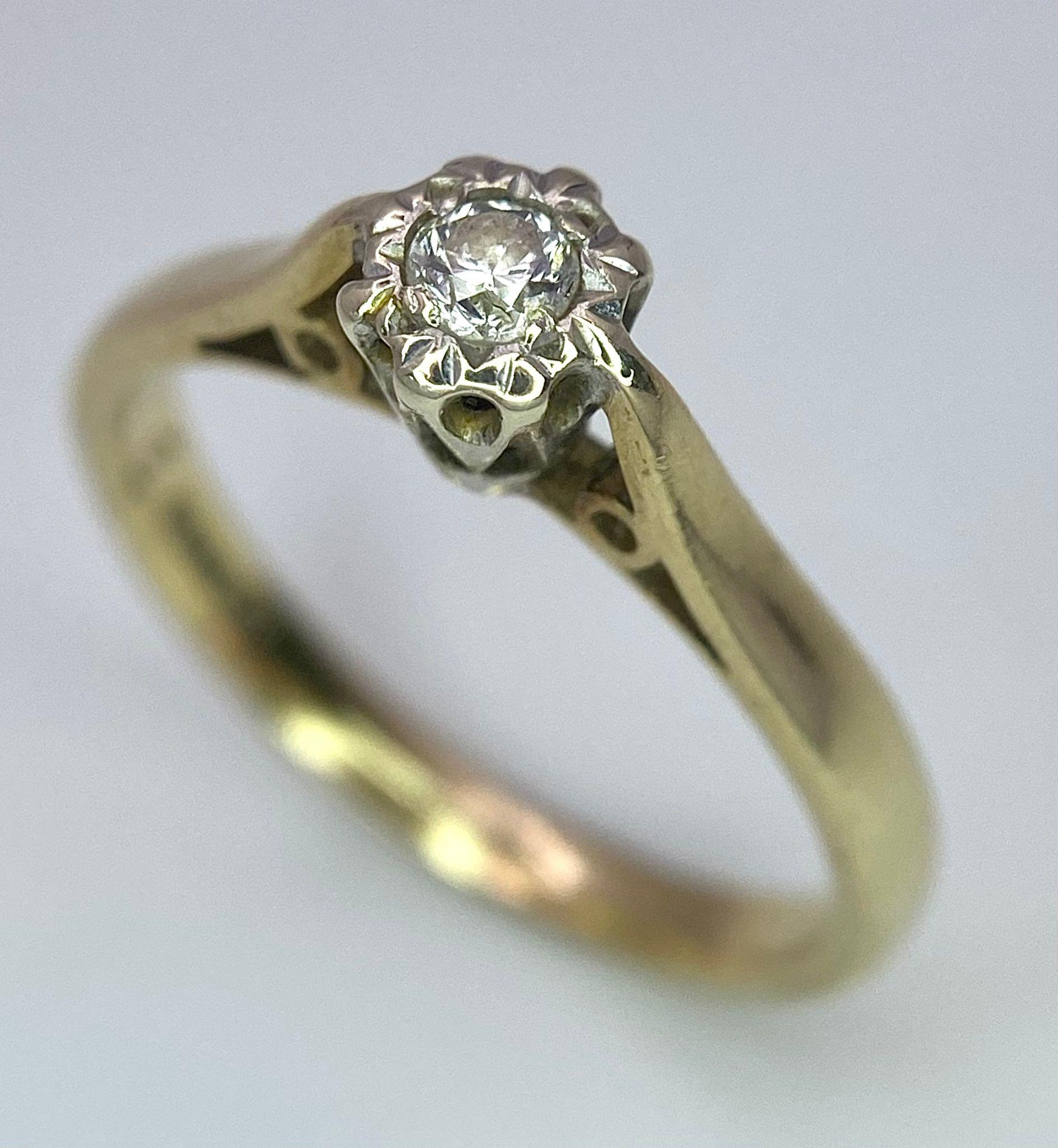 A 9 K yellow gold diamond solitaire ring, size: J1/2, weight: 1.8 g.