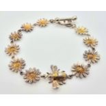 A STERLING SILVER SUNFLOWER AND BEE BRACELET WITH T BAR CLASP. 19.5cm, 13.2g total weight. Ref: SC