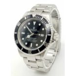A Rolex Submariner Oyster Perpetual Date Watch. Stainless steel bracelet and case - 40mm. Black dial