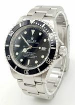 A Rolex Submariner Oyster Perpetual Date Watch. Stainless steel bracelet and case - 40mm. Black dial