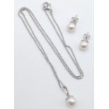 A Cultured Pearl Pendant with Necklace and Pair of Matching Earrings.