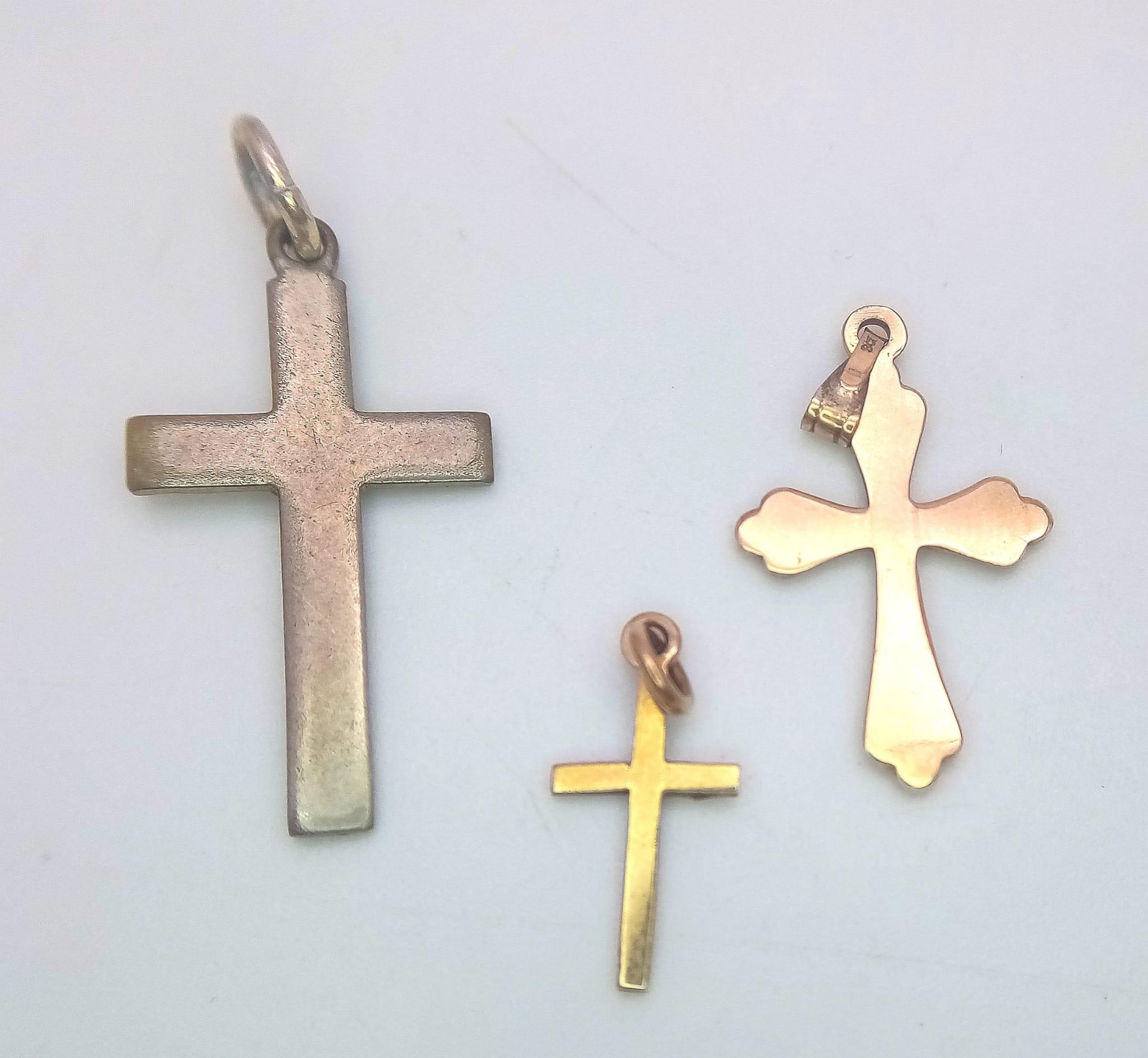 Three Different Size 9K Yellow Gold Cross Pendants. 30mm x 1.5mm largest pendant. 2.22g total - Image 3 of 4