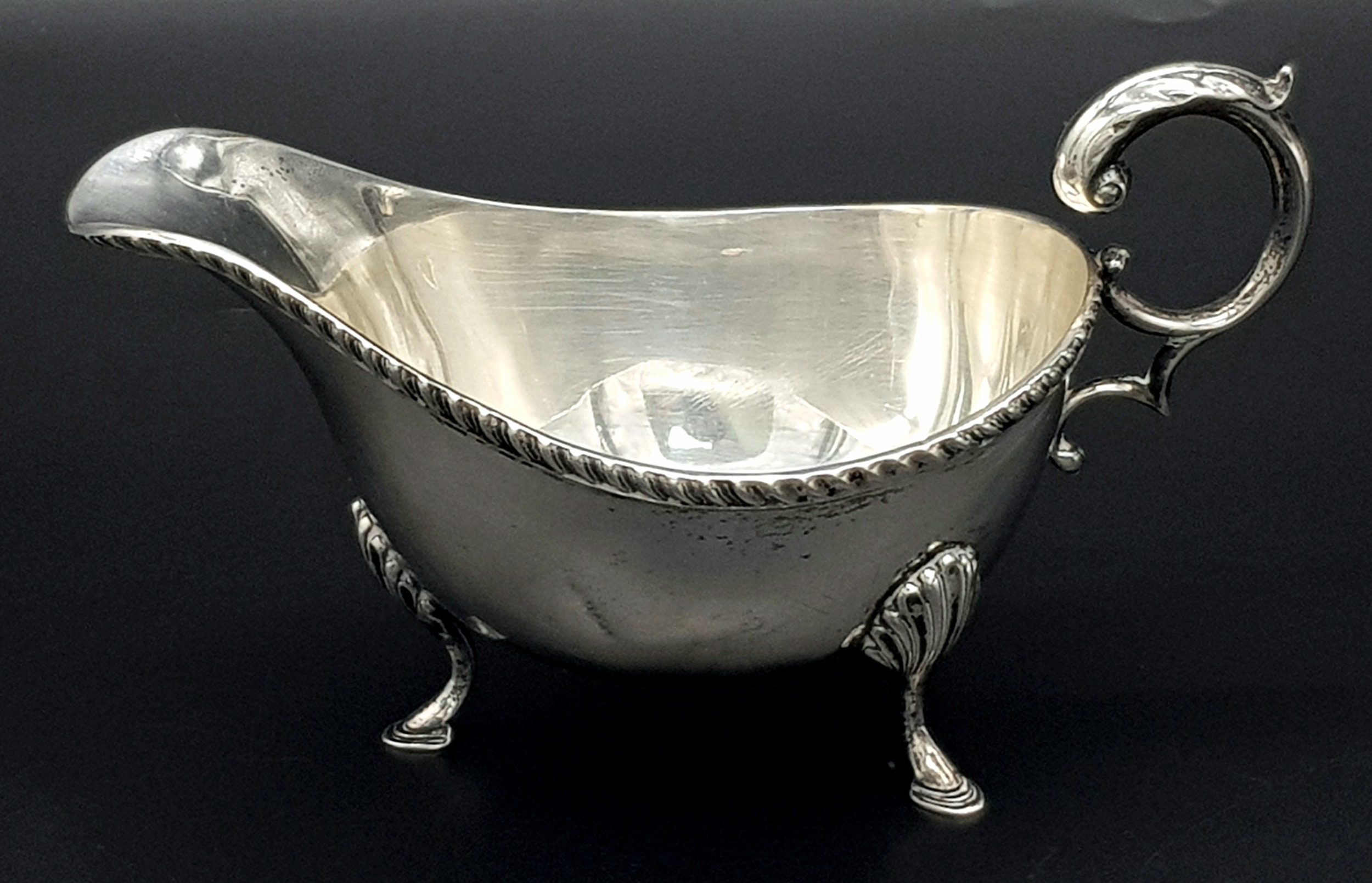 An Almost Antique Sterling Silver Gravy Boat. Scroll handle and shell decorative legs. Hallmarks for - Image 4 of 6