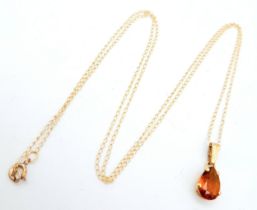 A 10K Yellow Gold Citrine Pendant on a 10K Yellow Gold Disappearing Necklace. 1cm and 44cm. 0.75g