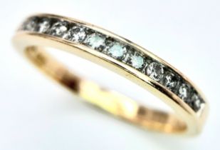 A 14K YELLOW GOLD DIAMOND HALF ETERNITY RING. 0.25ctw, Size N, 2.4g total weight. Ref: SC 8049