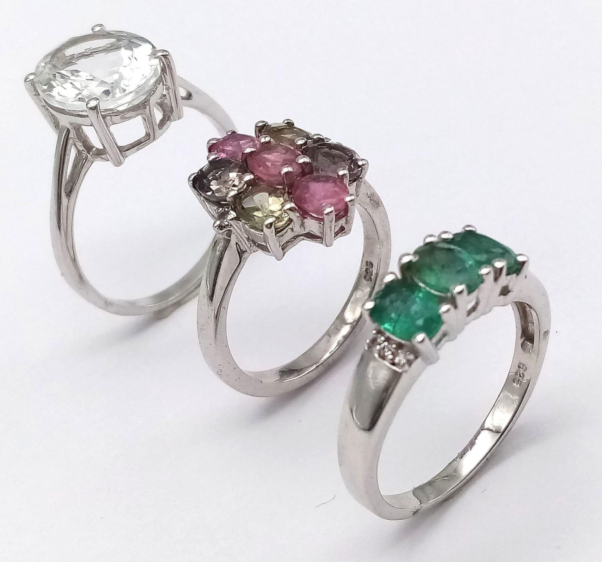 Three 925 Sterling Silver Gemstone Rings: Tourmaline - Size N, Topaz - Size S and Emerald - Size P.