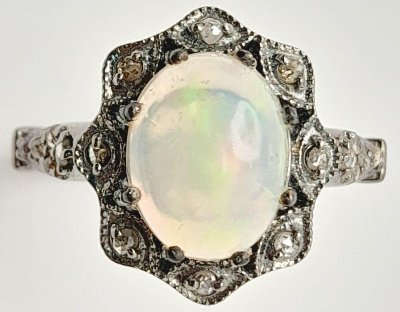 An Ethiopian Opal Ring with Rose Cut diamond Surround and Accents. Set in 925 Sterling silver. - Image 2 of 5