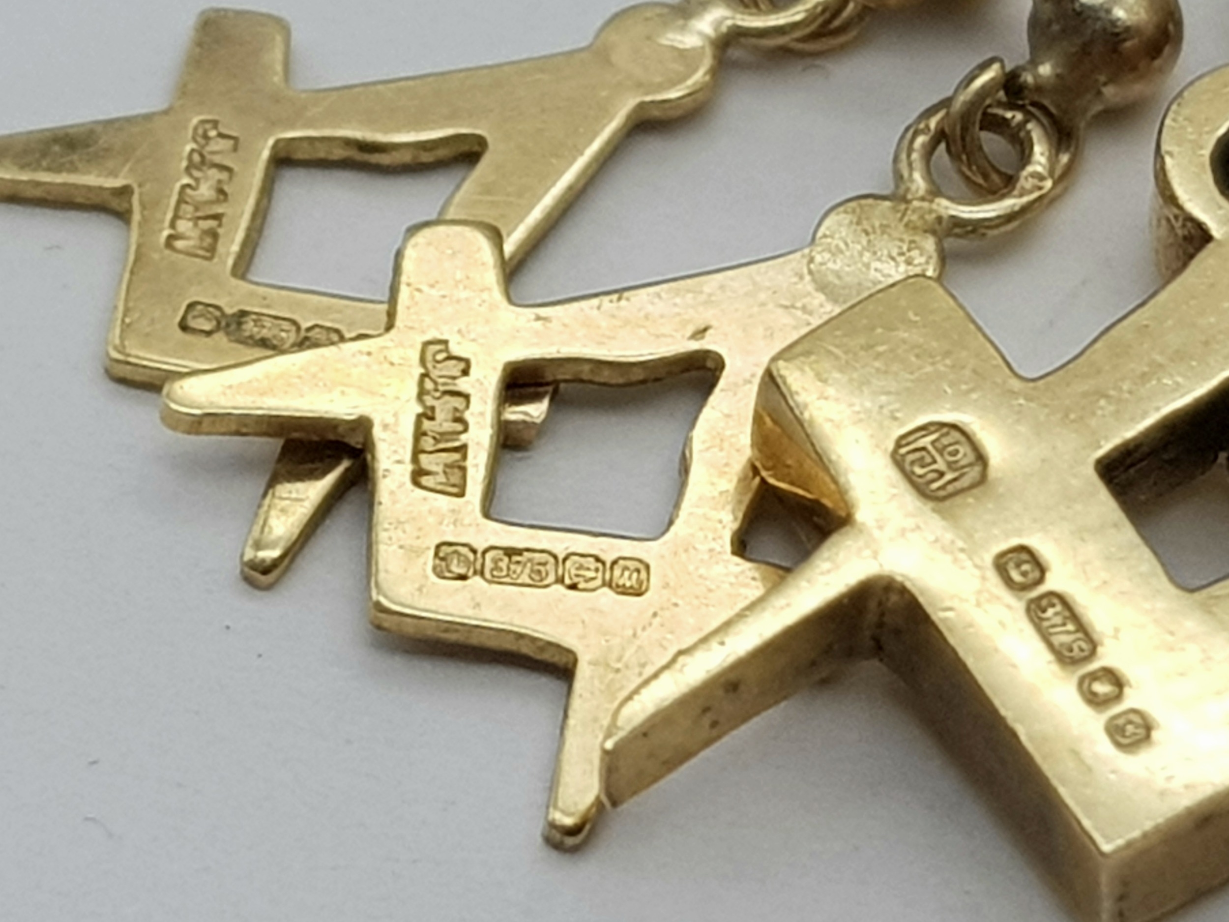 A Pair of Matching Masonic Symbol 9K Earrings and Pendant. 3.65g total weight. - Image 2 of 5