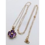 A pretty 9K Yellow Gold (tested as) Amethyst Flower pendant on Necklace, 1.3g total weight, 18”