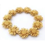 AN 18K YELLOW GOLD ASPREYS DAISY LINK BRACELET. 18cm length, 34.3g weight. Ref: SC8128