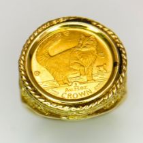 A Fine Gold (.999) Isle of Man 1/25th oz Coin. In a 14K gold ring setting. Size N. 4.8g total