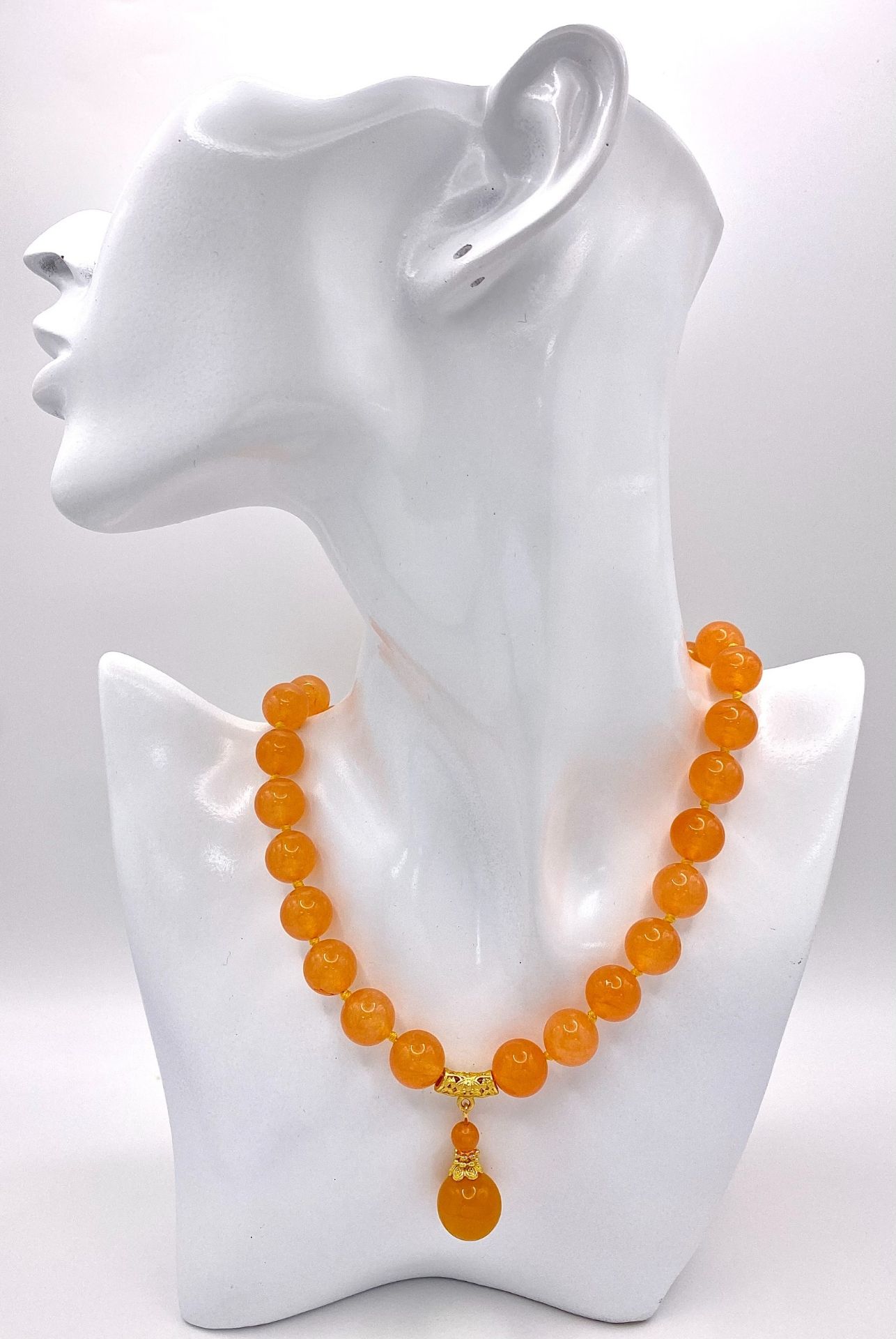 A Summery Orange Jade Beaded Necklace with Drop Pendant. 12mm beads. Gilded accents and clasp. 3.