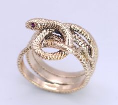 A 9K Yellow Gold Serpent Ring. A three band coiled body, ready to strike with ruby eyes. Size M 1/2.