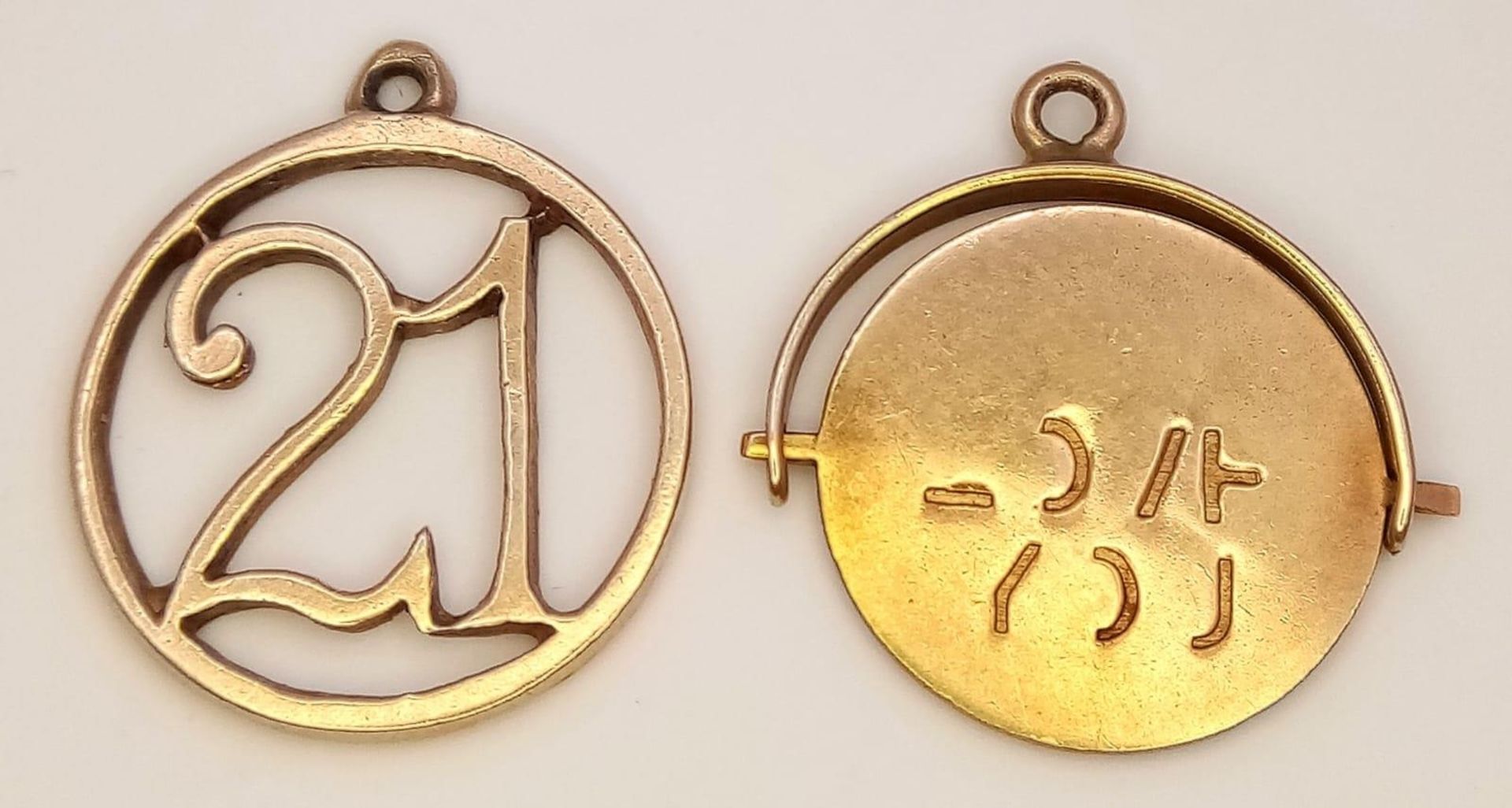 A 9K Yellow Gold '21' and a Spinning Love Pendant/Charm. 20mm. 1.87g total weight.