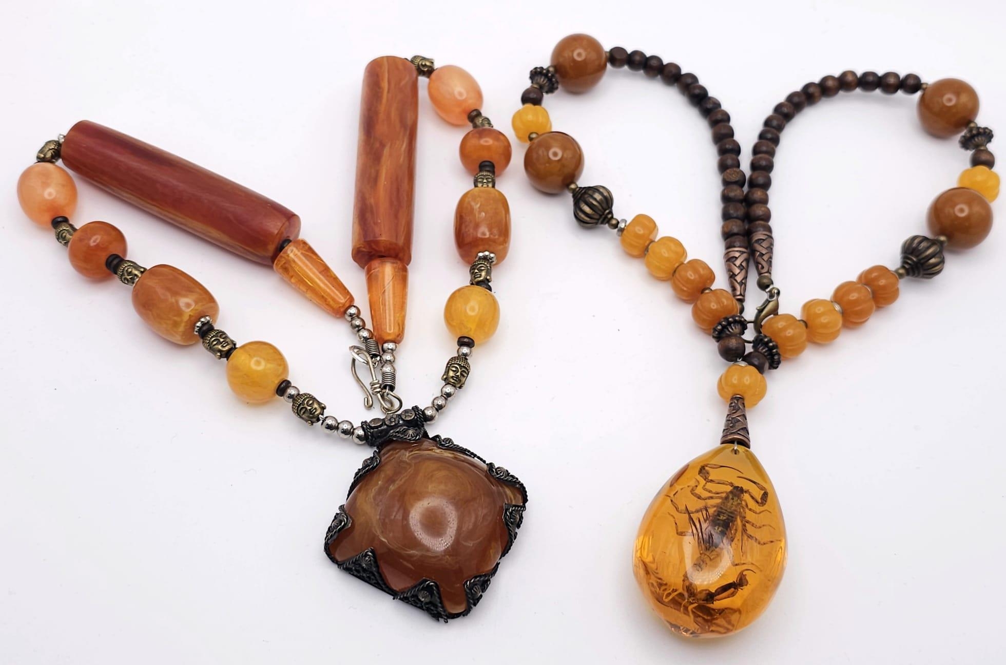 Two Amber Resin Statement Necklaces and Pendants. Both 56cm.