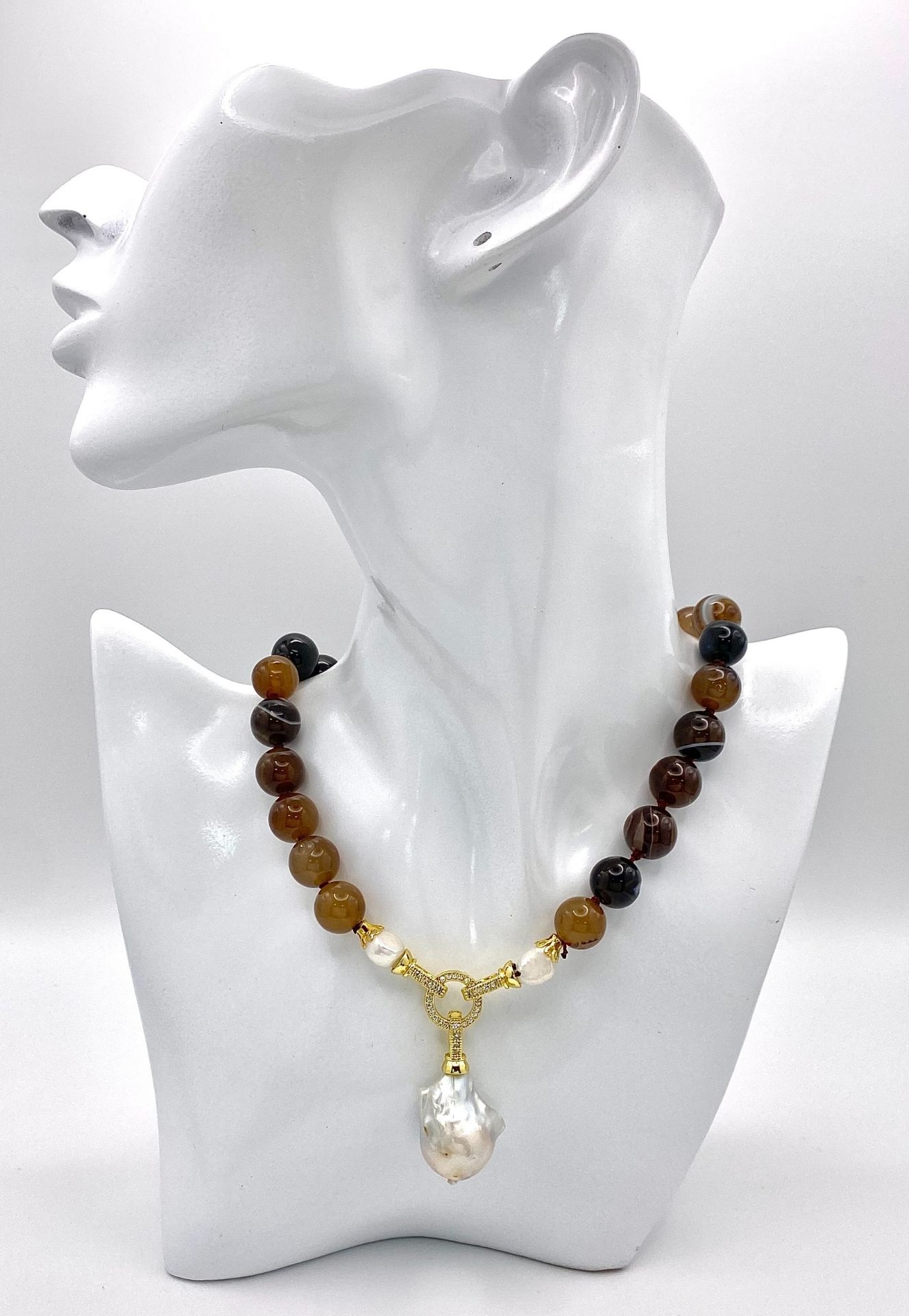 A Brown Stripe Agate Beaded Necklace with Hanging Baroque Keisha Pearl Pendant. 12mm beads. Gilded