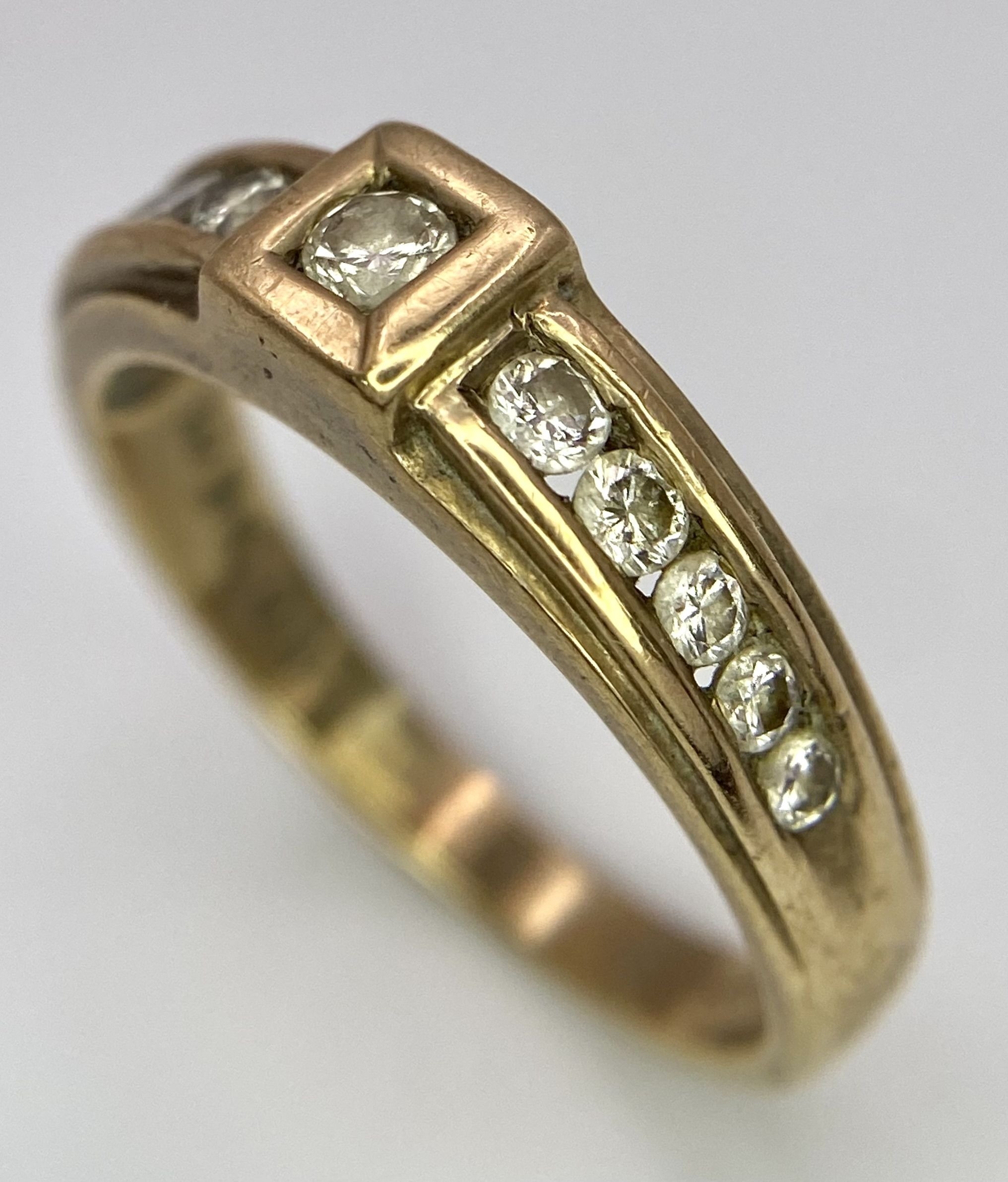 A Vintage 9K Yellow Gold Diamond Half-Eternity Ring. Belt buckle design. Size R. 3.7g total weight. - Image 4 of 6